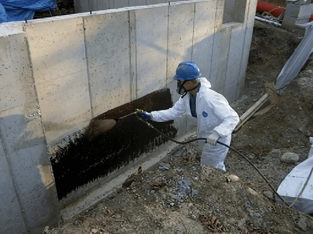 Professional waterproofing the exterior walls of the basement in Los Angeles, CA